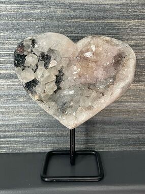 Natural amethyst heart on black stand
